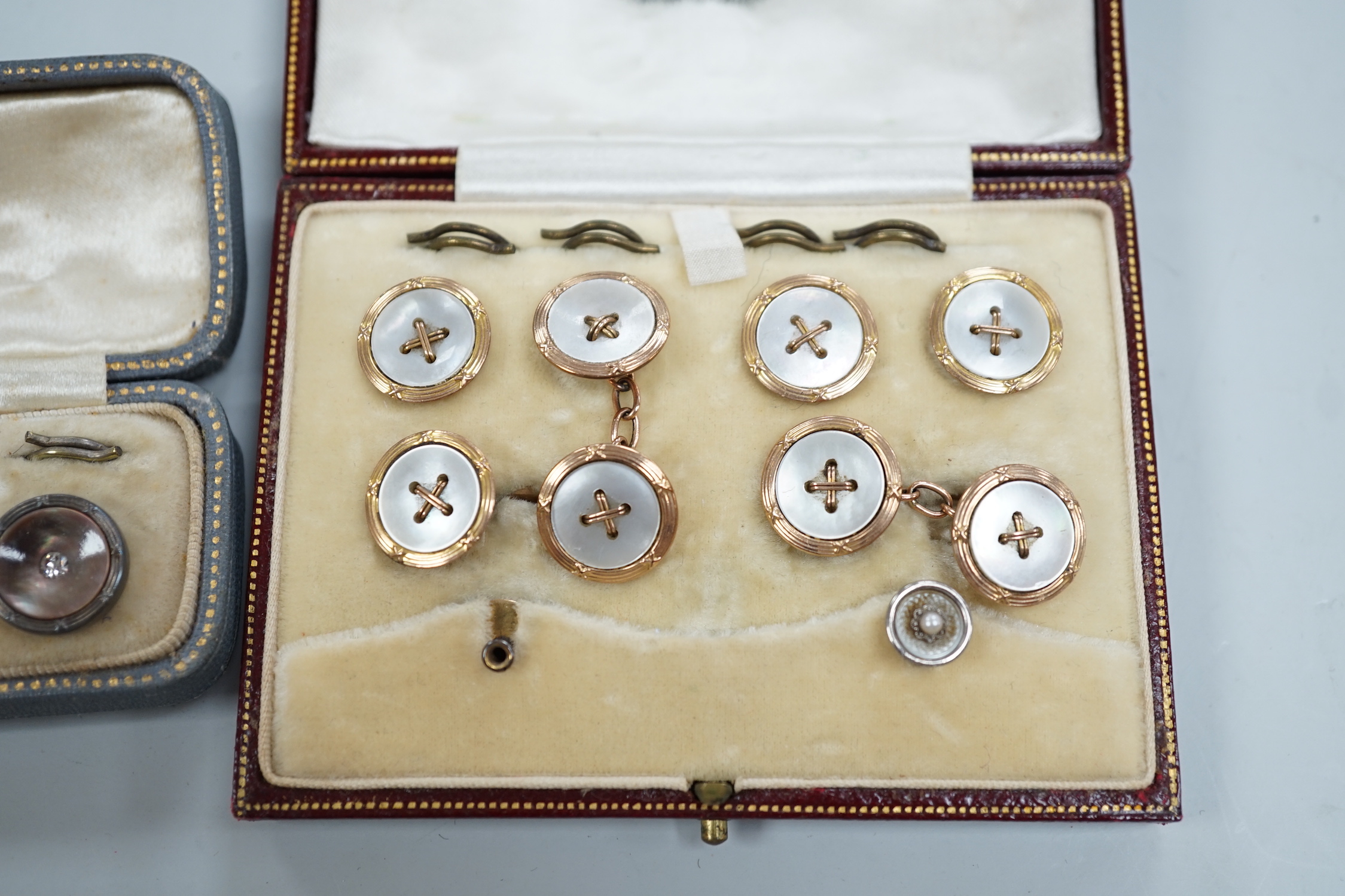 Two cased part dress stud sets, including 9ct and mother of pearl.